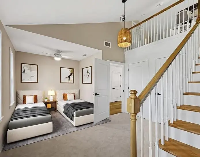 Finished bedroom and the rebuilt staircase with wood treads and white balusters — a completed CMD whole-home renovation